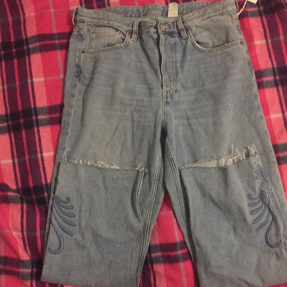 Light blue high waste demon jeans with design.